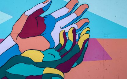 colorful-mural-hands-reaching-down