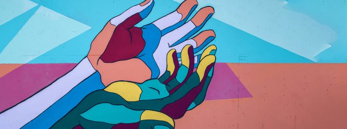 colorful-mural-hands-reaching-down