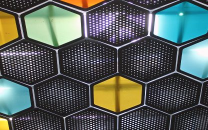 A close up of a wall made of hexagonal tiles photo