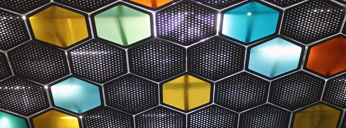 A close up of a wall made of hexagonal tiles photo