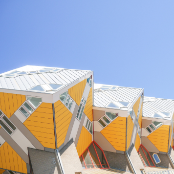 row-of-yellow-and-white-buildings-with-a-blue-sky