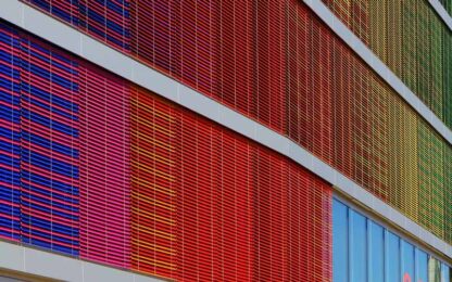 A building with colorful panels extending out