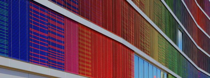 A building with colorful panels extending out