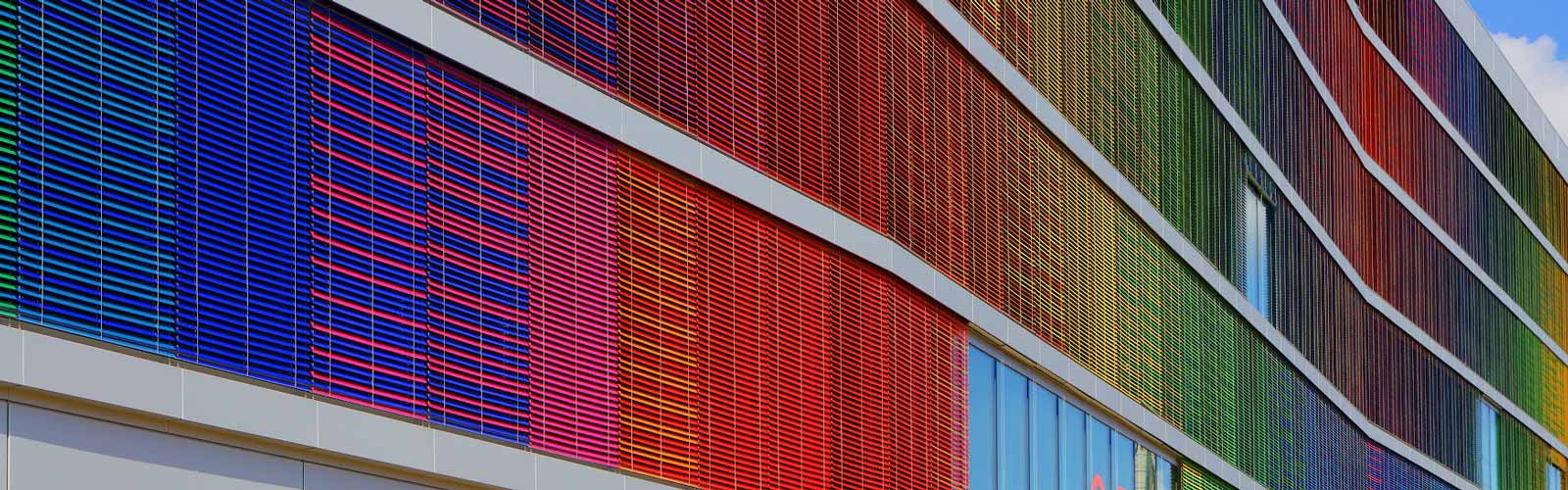 A building with colorful panels extending out