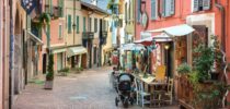 View of street with cafe in Luino, Italy