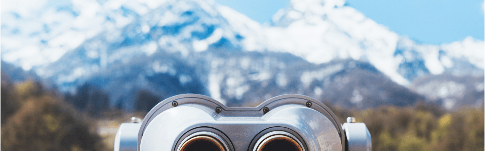 touristic telescope look at the city with view snow mountains