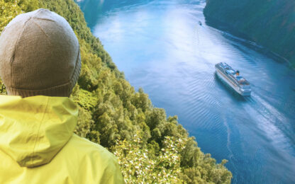 Person looks over a waterway in Norway