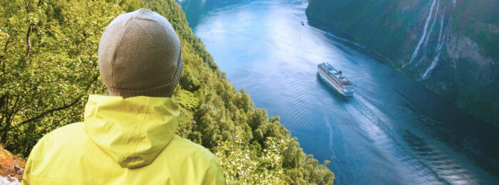 Person looks over a waterway in Norway