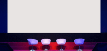 chairs on stage in conference hall at business event or seminar meeting
