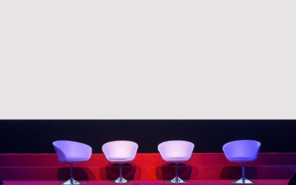 chairs on stage in conference hall at business event or seminar meeting