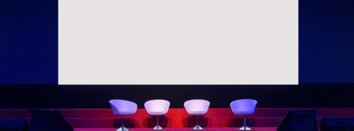 chairs on stage in conference hall at business event or seminar meeting