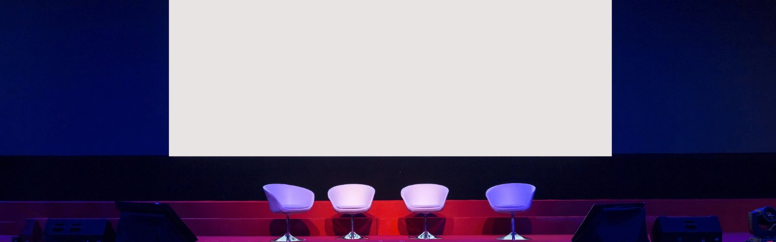chairs on stage in conference hall at business event or seminar meeting
