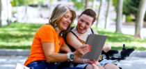 Women laughing in park