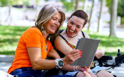 Women laughing in park