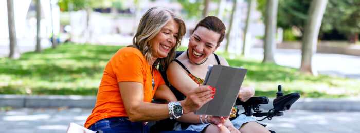 Women laughing in park