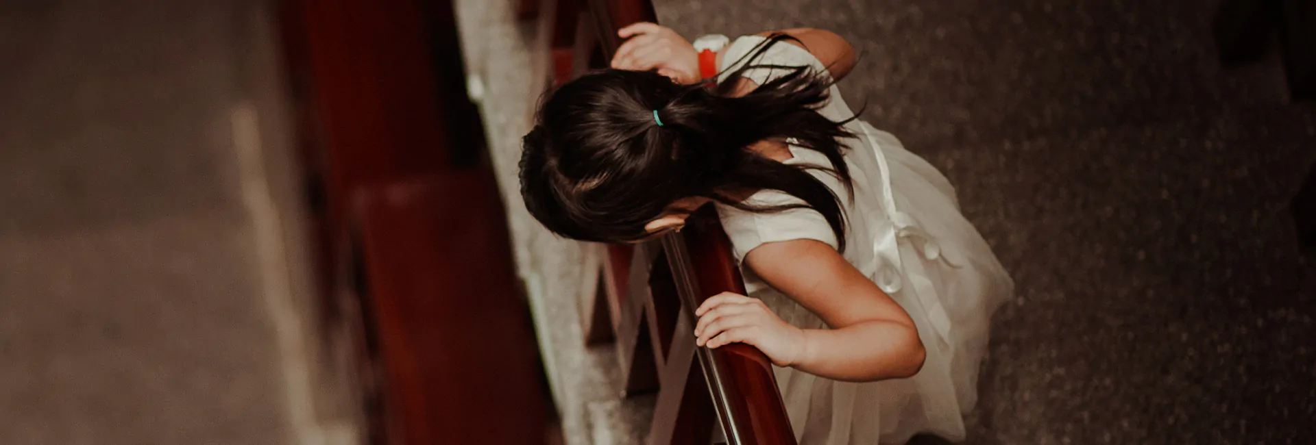 girl-looking-overrail-from-second-floor