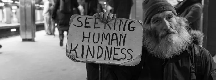 man-holding-sign-in-subway