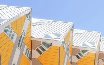 row-of-yellow-and-white-buildings-with-a-blue-sky