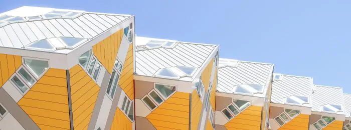 row-of-yellow-and-white-buildings-with-a-blue-sky