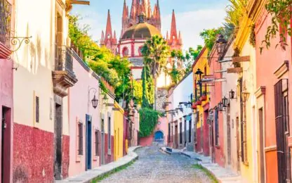 Vibrant, colorful buildings line a street in Mexico