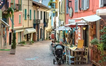 View of street with cafe in Luino, Italy