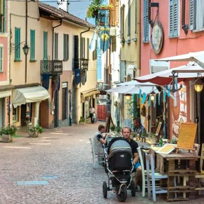 View of street with cafe in Luino, Italy