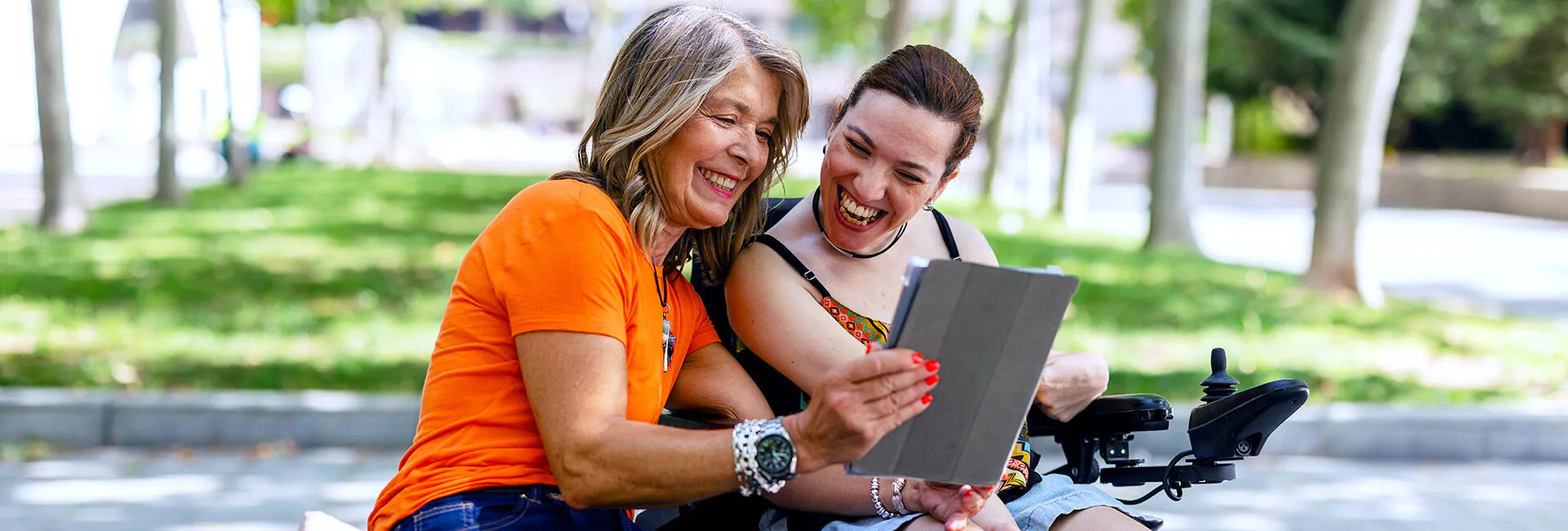 Women laughing in park